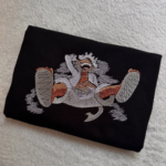 Gear 5 Laugh and Logo Embroidery Design stitched by a customer
