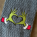 Grinch Swoosh Christmas Embroidery Design stitched by a customer