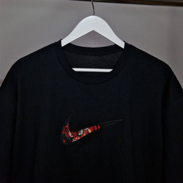 Asta Swoosh Eyes Embroidery Design stitched by a customer