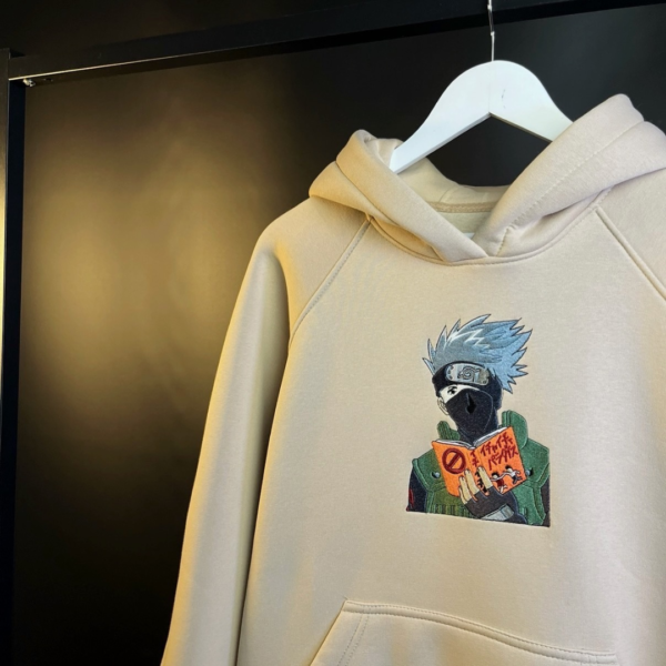 Kakashi Reading and Logo Embroidery Design stitched by a customer